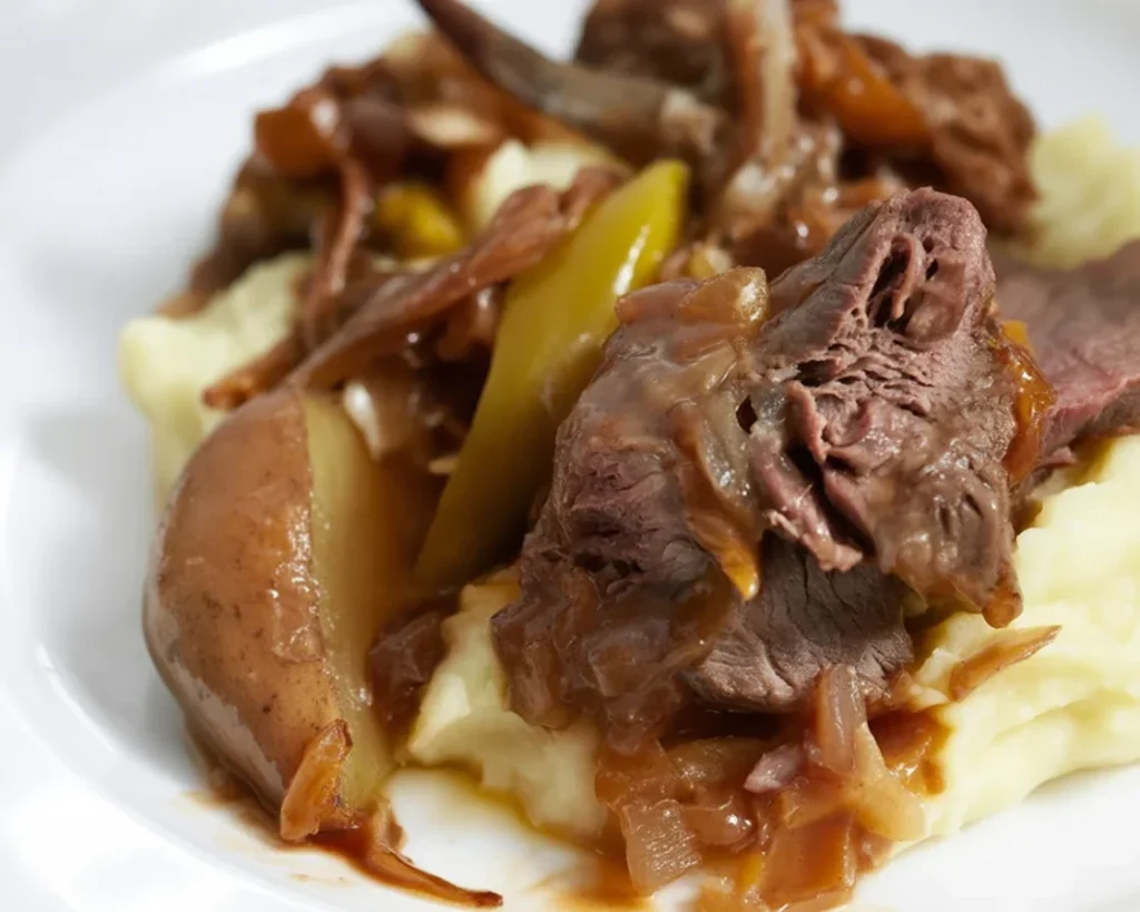 Mouthwatering Butter Beef dish served with sides, showcasing its rich flavor and tender texture.