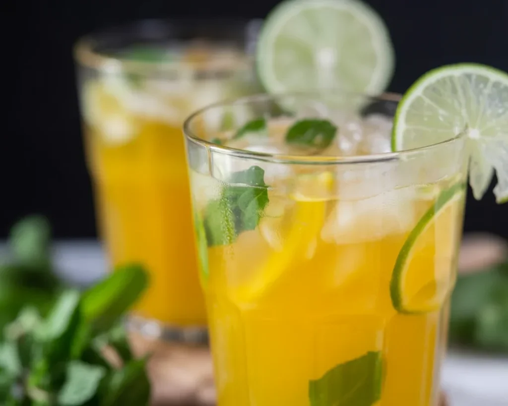 Refreshing Mango Mojito cocktail with fresh mint, lime, and rum served in a glass.